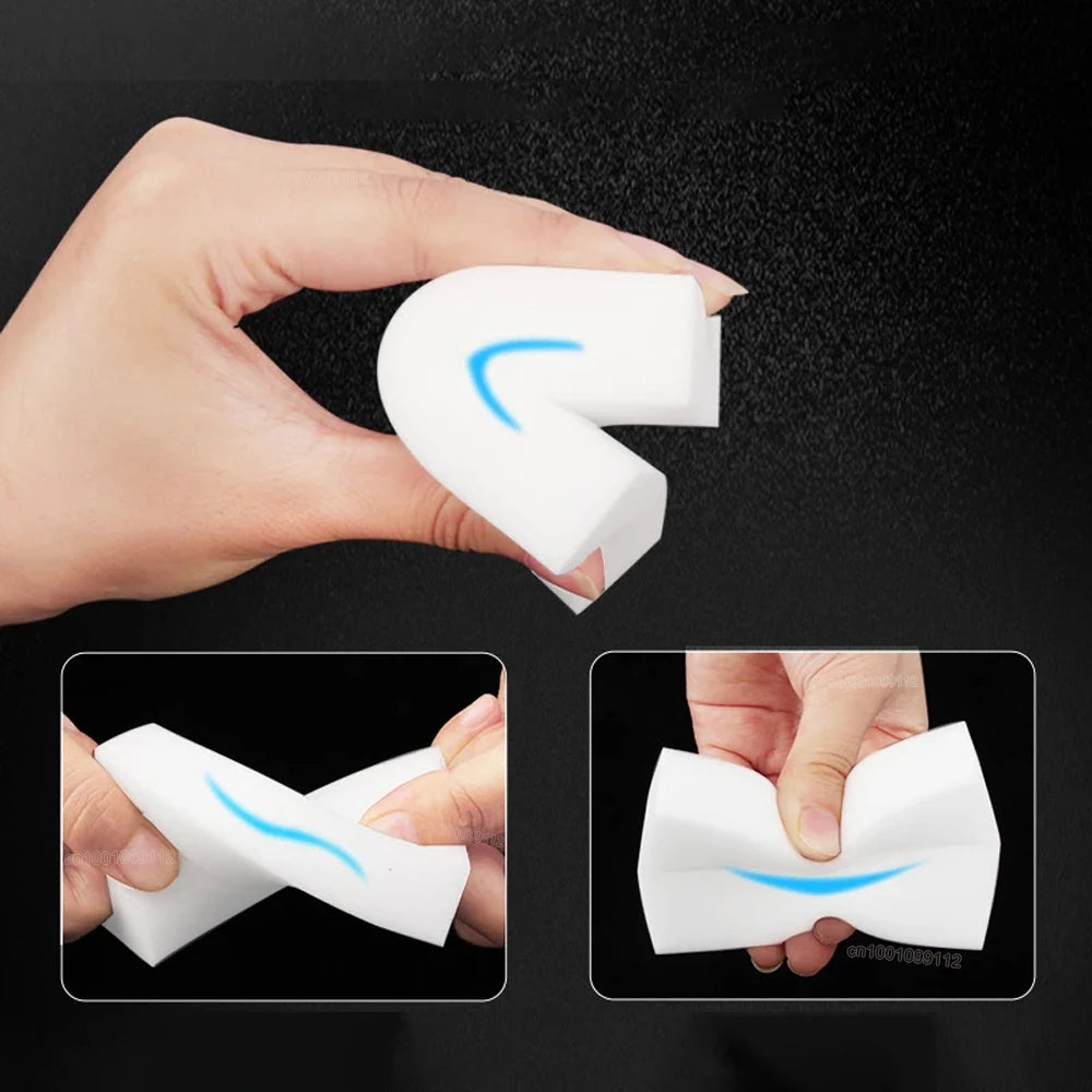 Hand holding a white foam product with blue accents, demonstrating its use on a black background.