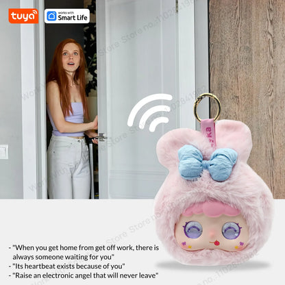 Pink electronic angel keychain with a woman opening a door in the background, featuring Tuya Smart Life branding.