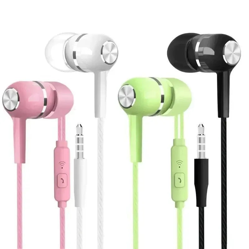 Four pairs of colorful earphones in pink, white, green, and black on a white background.