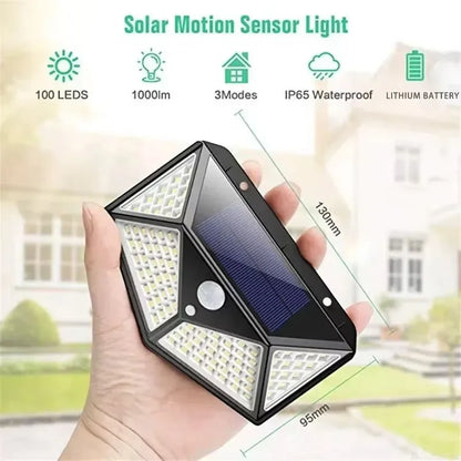 Solar motion sensor light held in a hand with specifications listed above.
